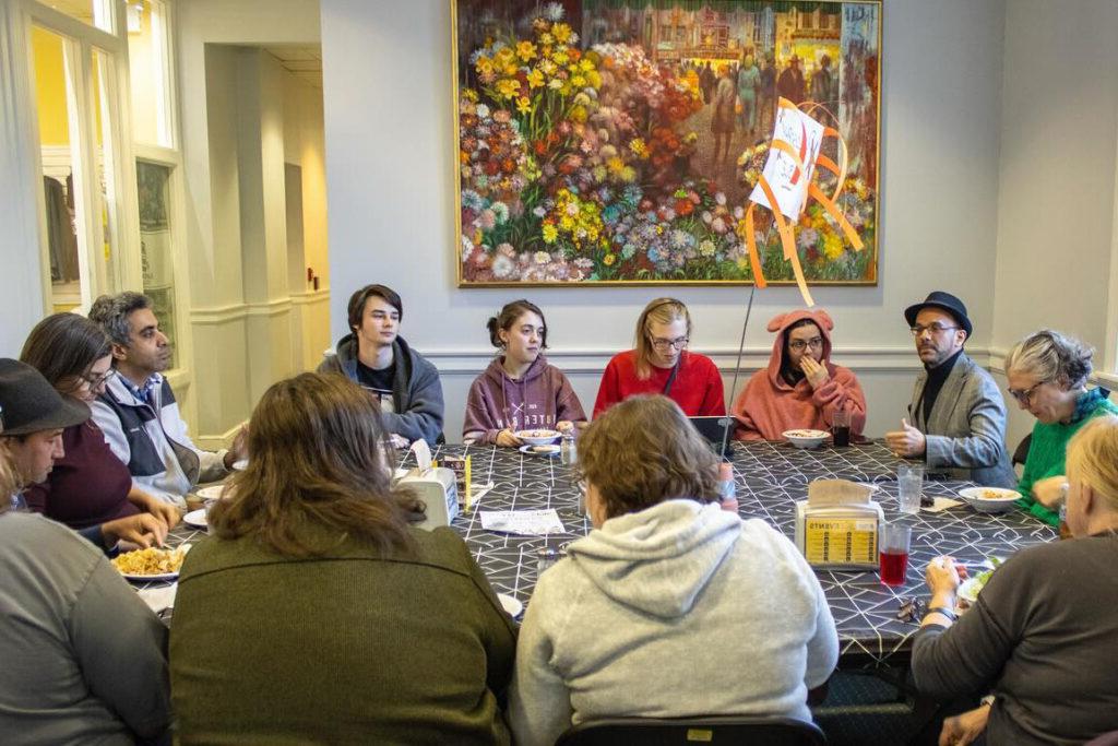 Students and professors converse weekly around the Philosophy Table.