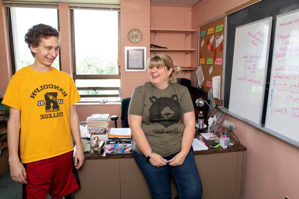 Professor Crystal Howell and Caleb Schmitzer '21 go over their notes from his Summer Research project on the use of social media in teacher strikes.