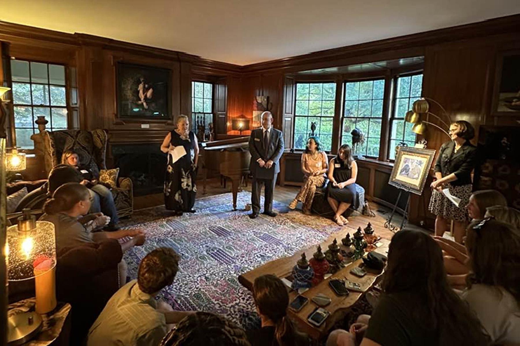 President Sue Ott Rowlands speaks to Honors Scholars in her parlor at Randolph House.